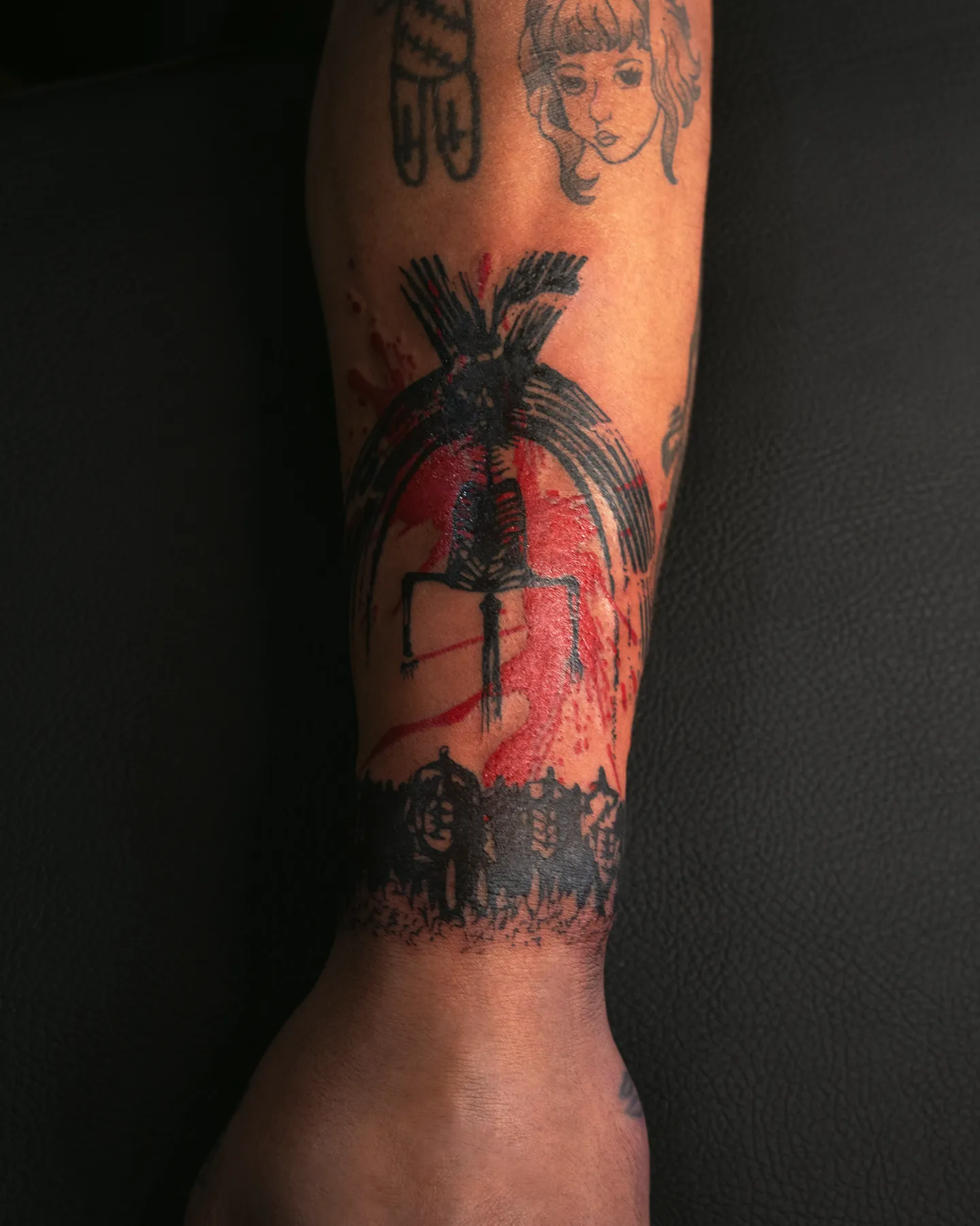 Abstract black and red anime tattoo