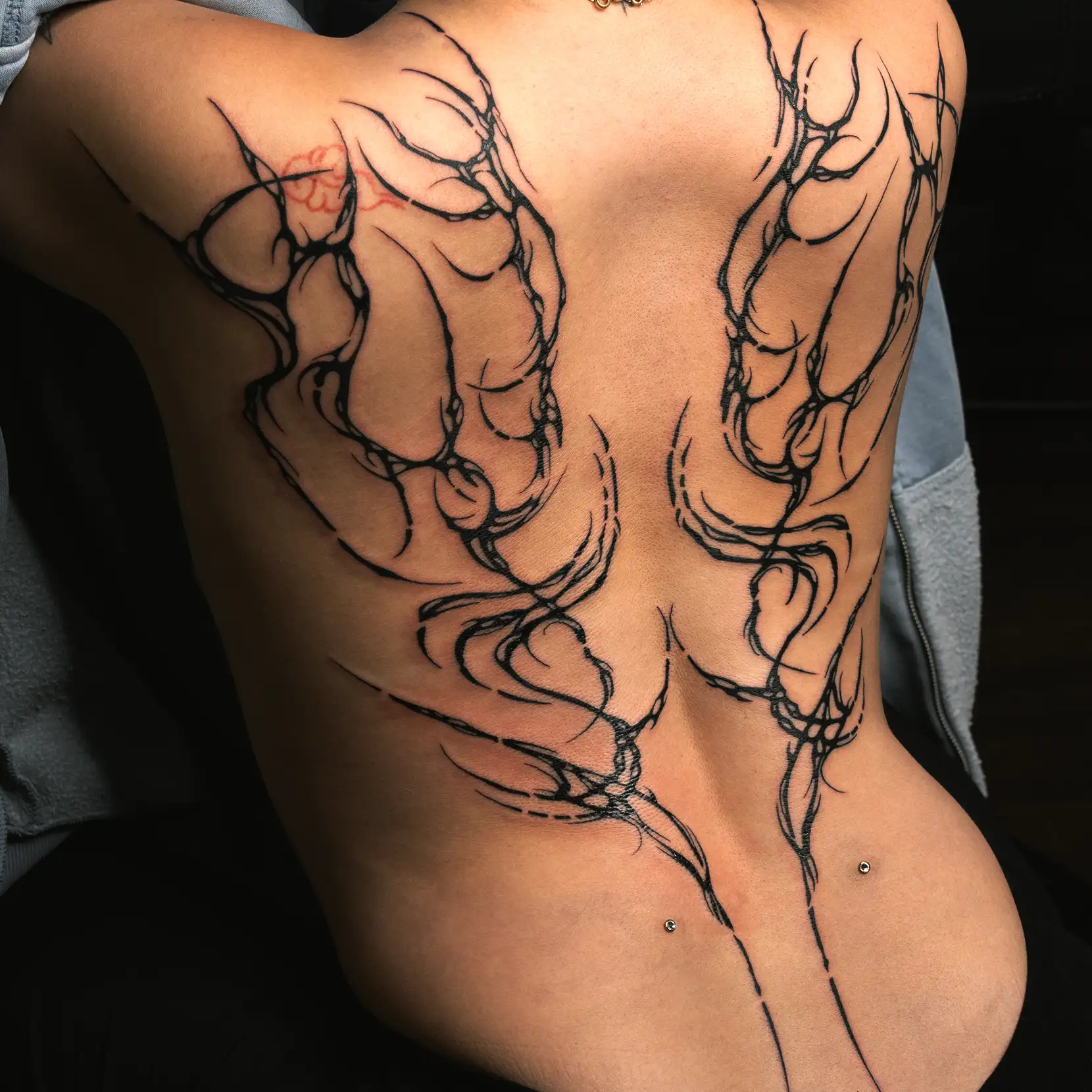 Womens feminine back tattoo