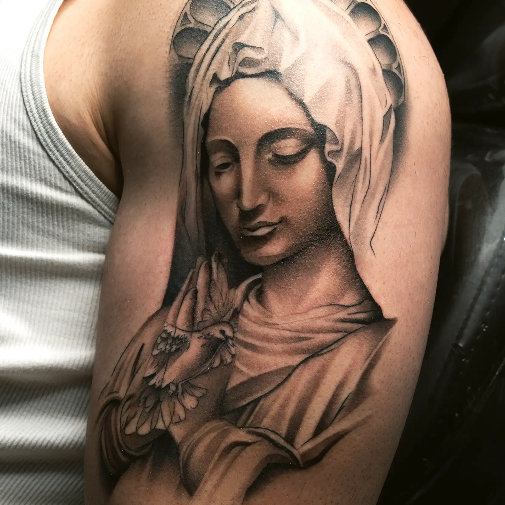 Virgin Mary realism arm tattoo