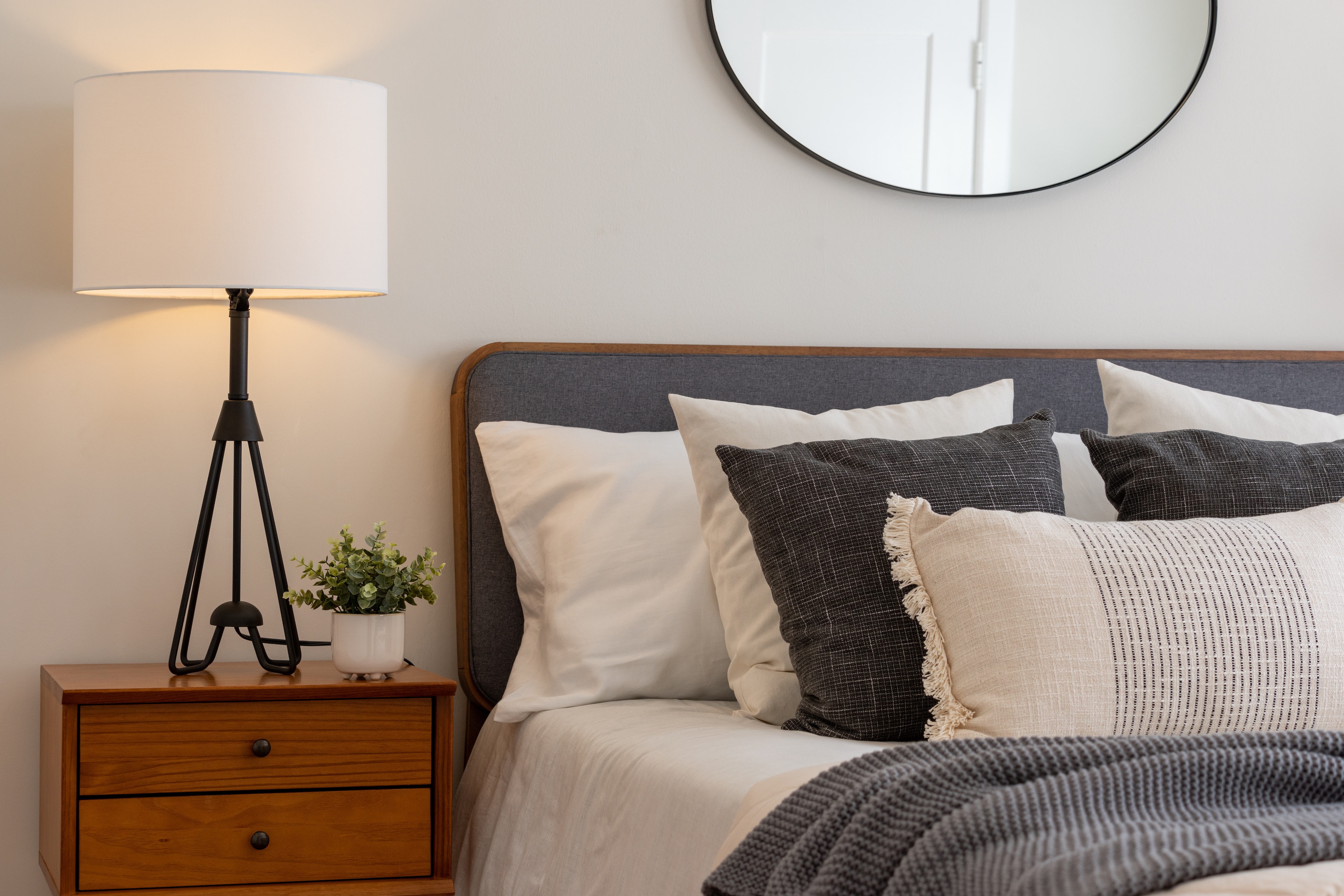 Bed with nightstand stock image