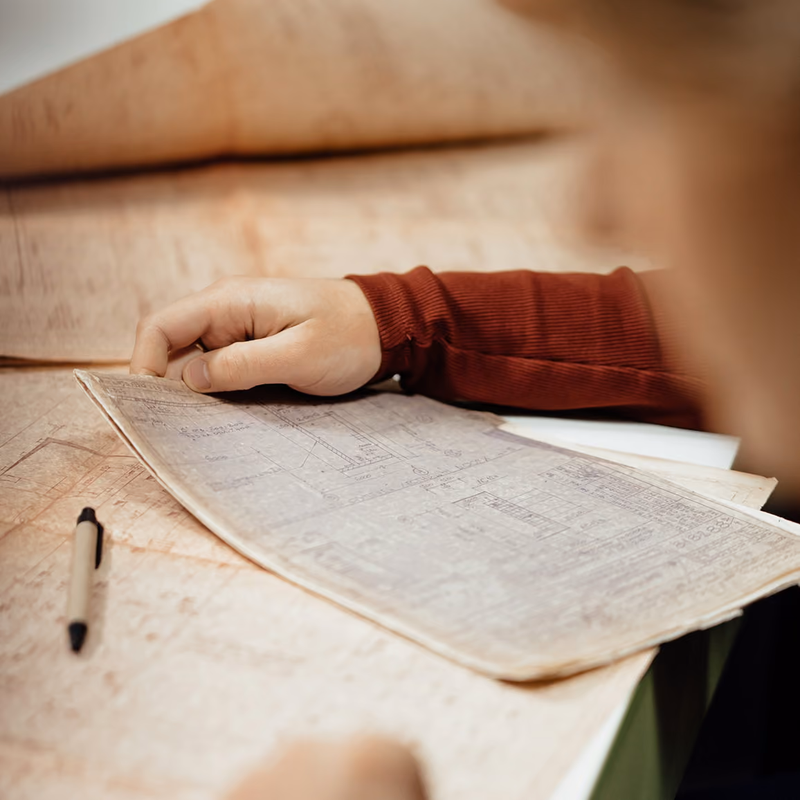 Person researching historical county records documents
