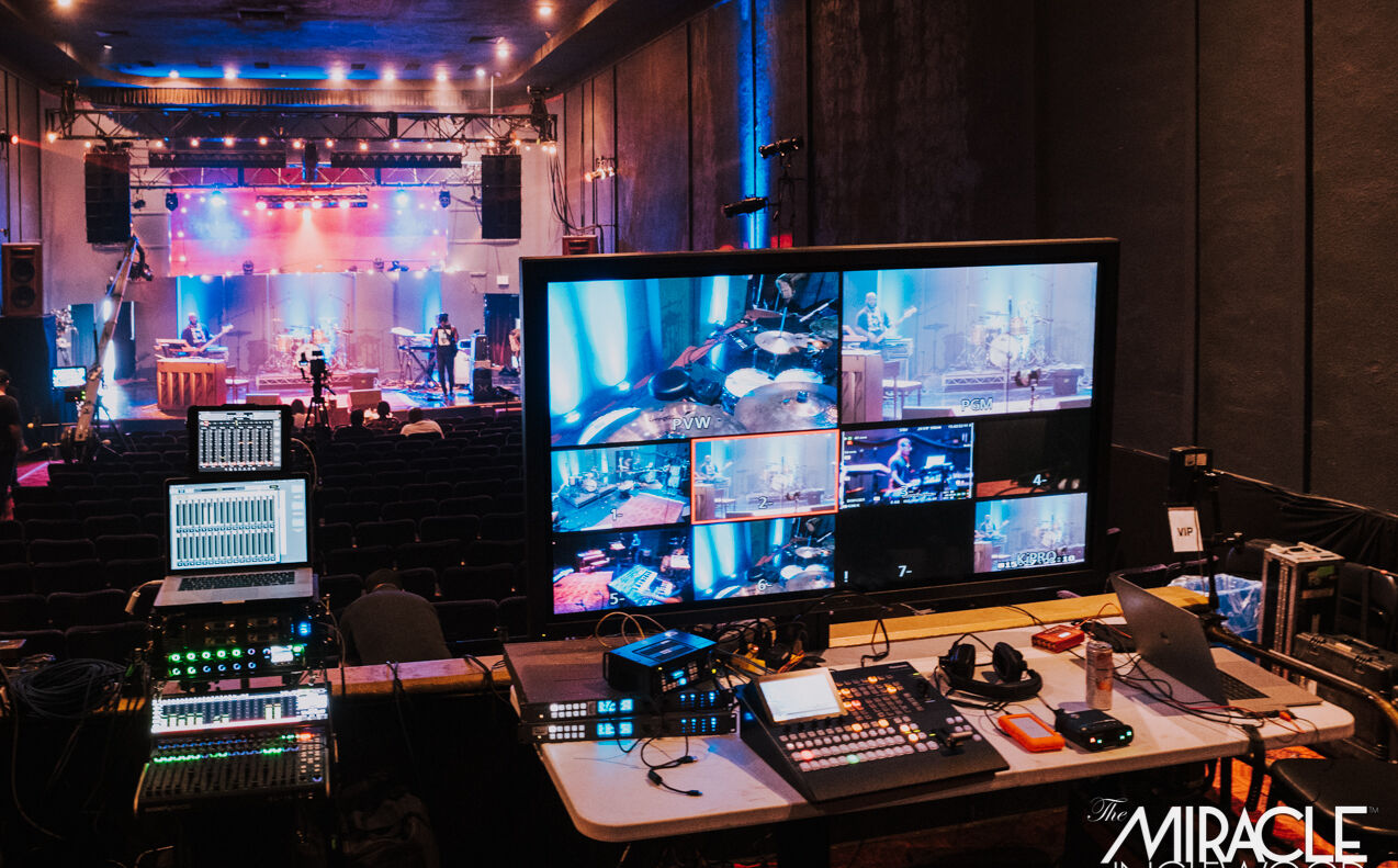 The video village: switcher, monitors and a multiview feed of the lit stage
