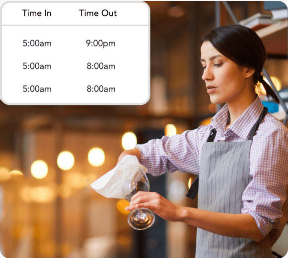 Woman in apron polishing a wine glass in a softly lit restaurant bar with a time log showing Time In and Time Out entries.