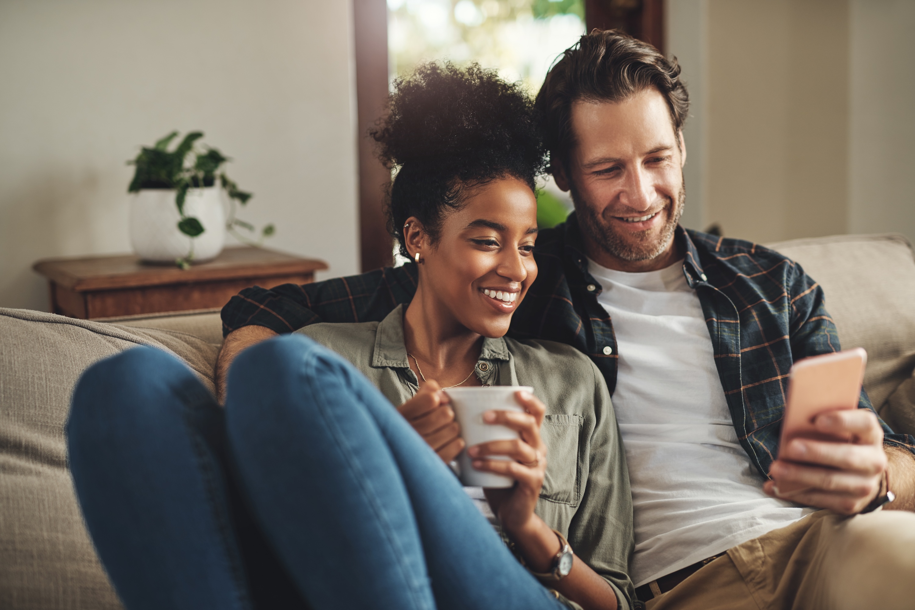Man on phone with woman sitting next to him stock image