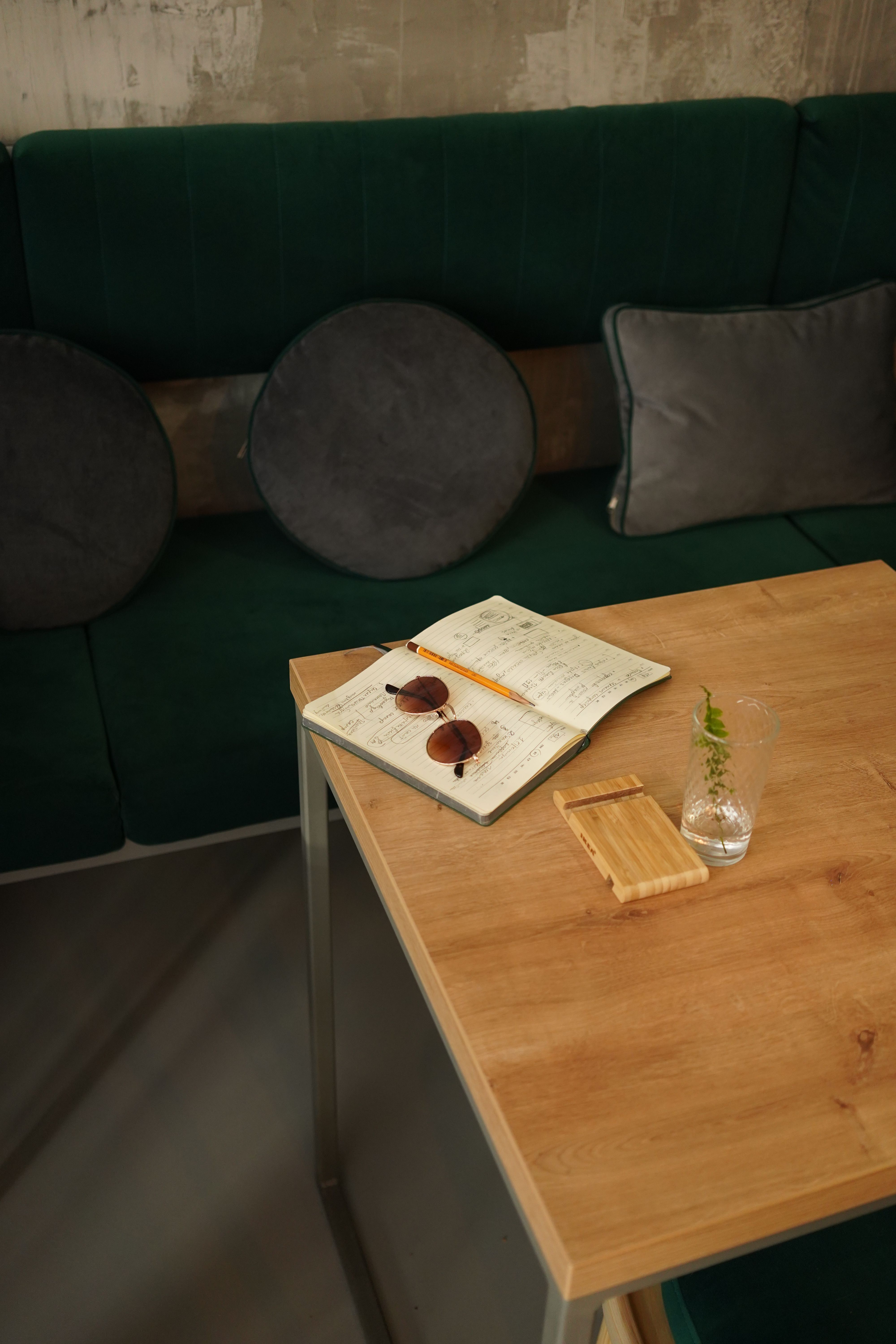 Green couch with coffee table and decor