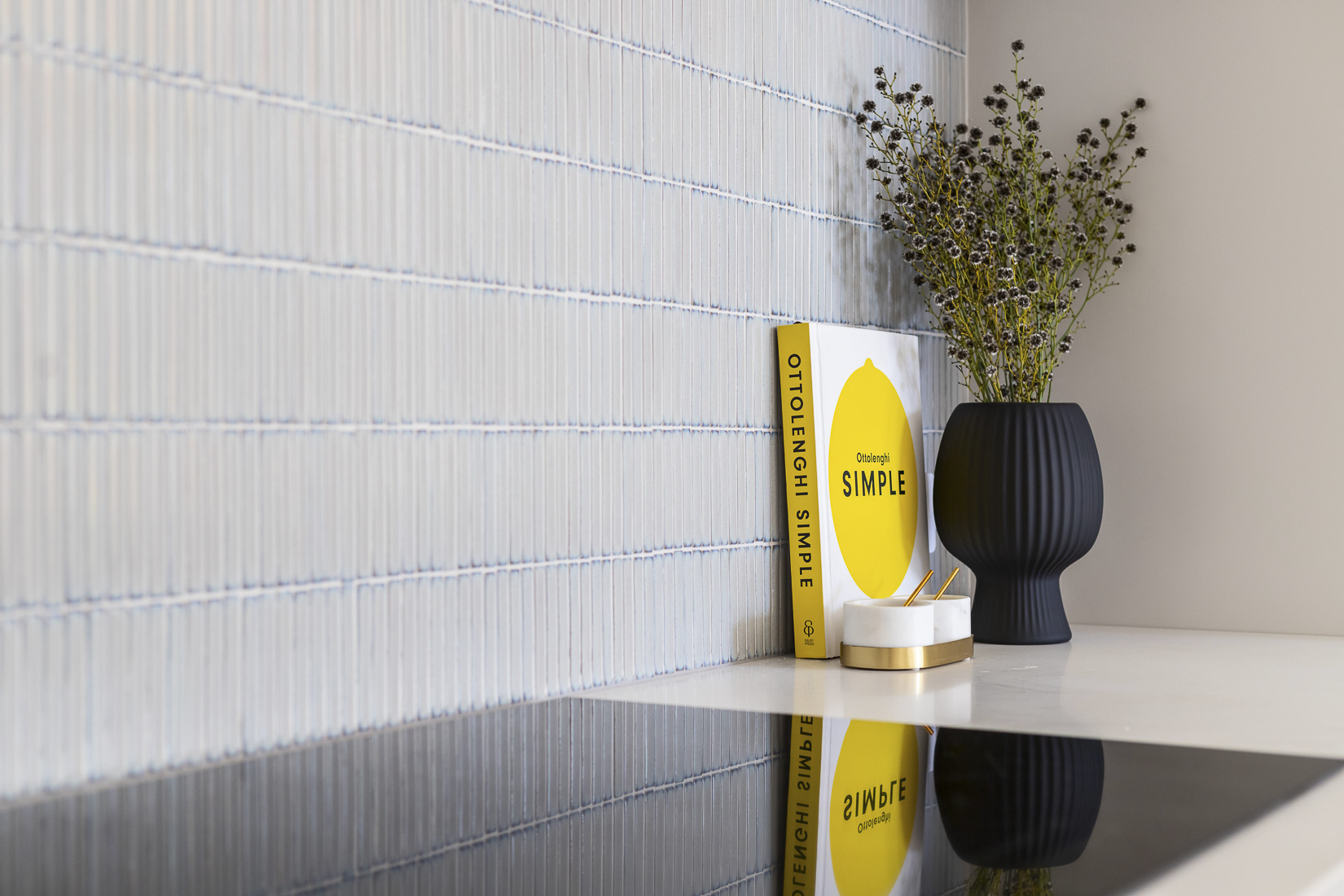 Styled interior detail with a tiled splashback in a Perth home