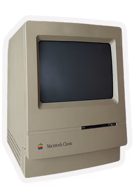 Vintage beige Macintosh Classic computer with a small screen and Apple logo on front panel.