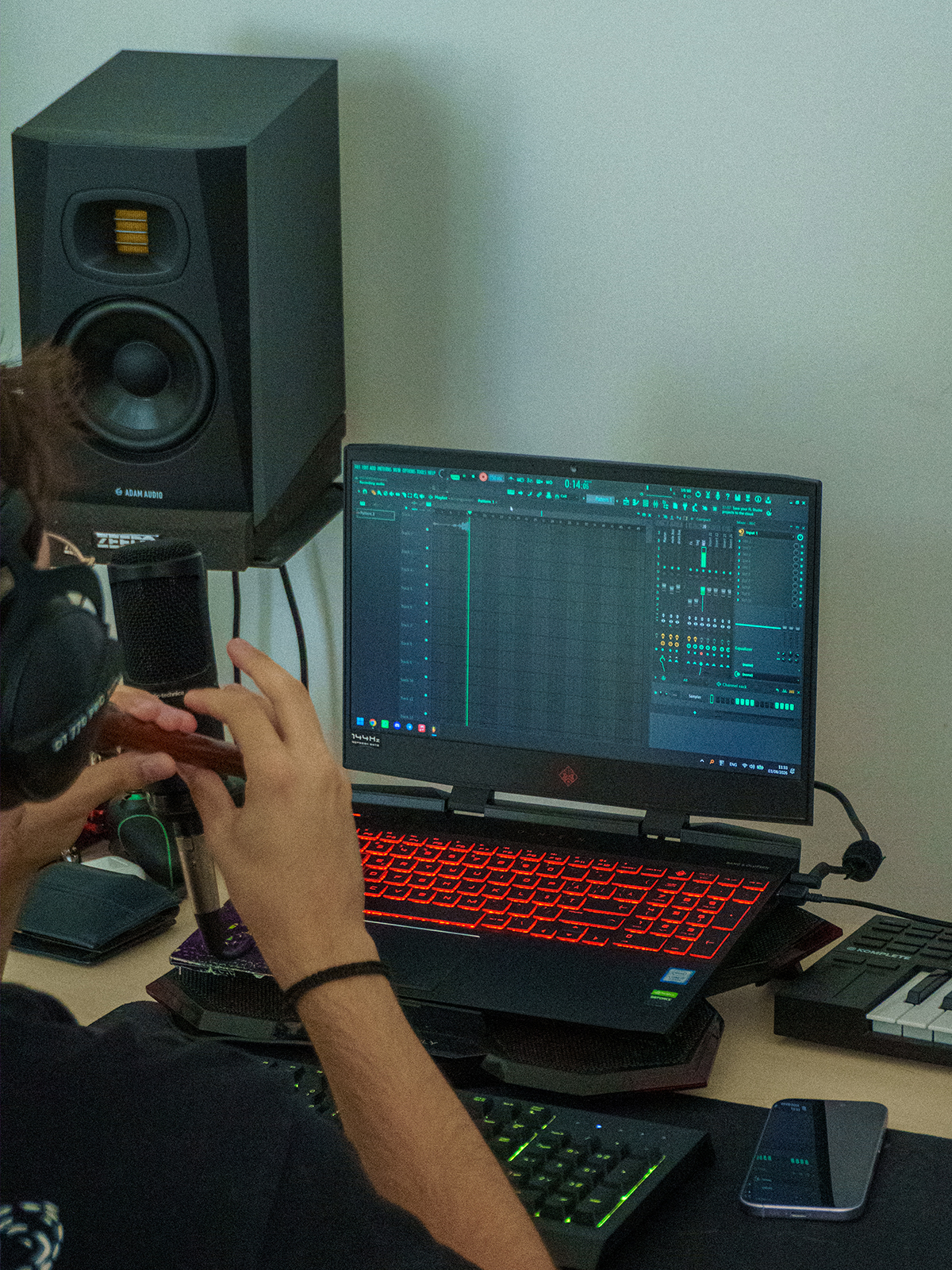 A person recording flute melodies in his studio.
