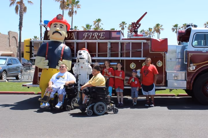 Tucson firefighters with the Adopt-a-Family Program