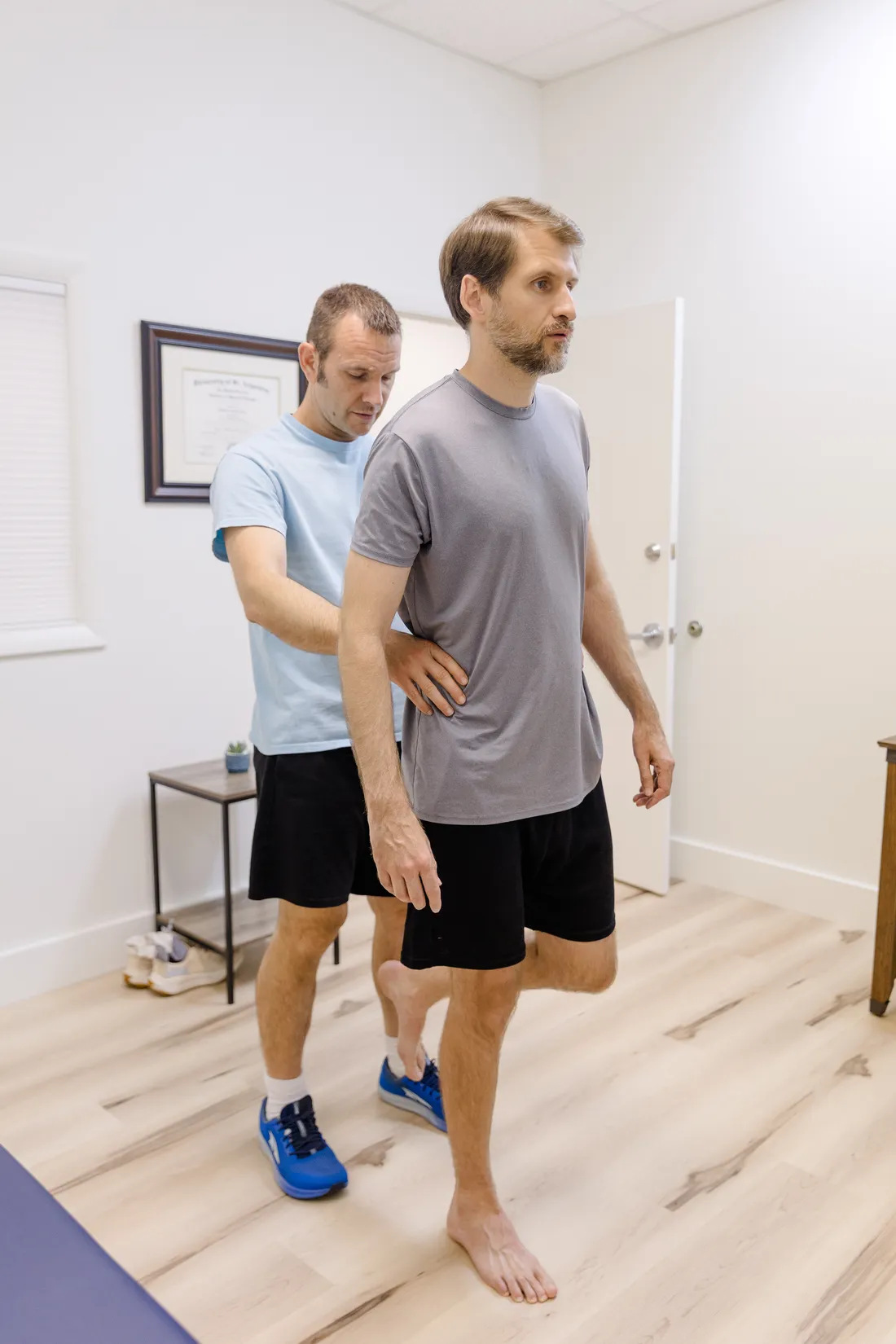 Matt Rieder, DPT, watching how a patient walks during a full-body physical therapy evaluation in St. Augustine, FL