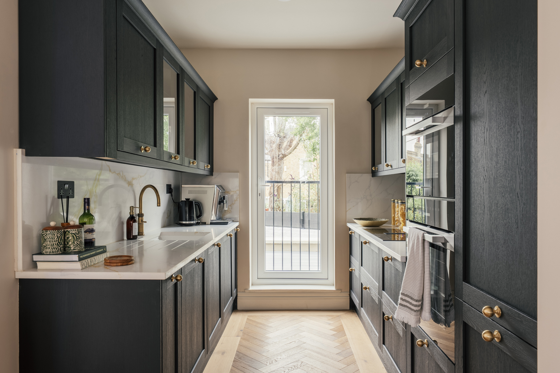 Separate galley kitchen with integrated appliances