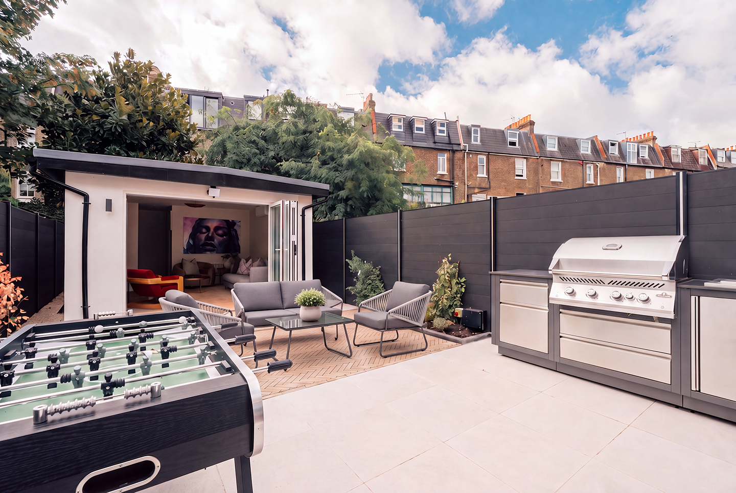 Enjoy outdoor dining in the private garden, complete with a kitchen and barbecue.