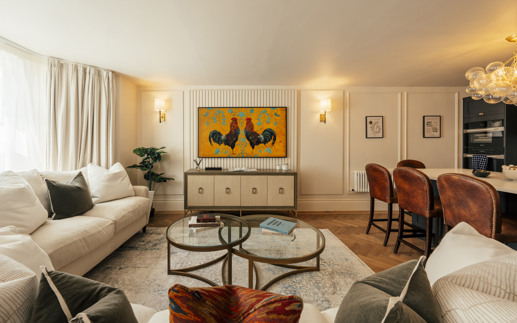 Open-plan living and dining space with a bay window