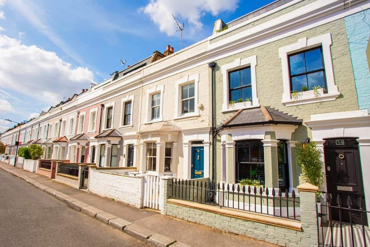 A peaceful row of pastel terraces in Parsons Green, close to local gems and lush open spaces.