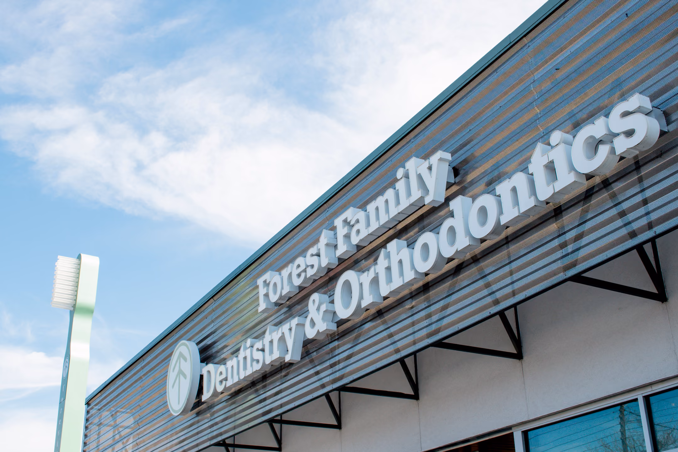 showing the storefront of a forest family dentistry office