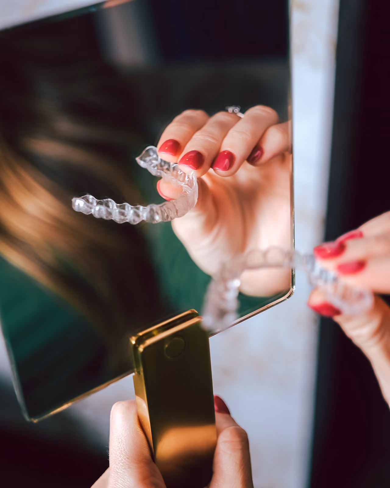 Clear Invisalign aligner held during a Forest Family Dentistry consultation
