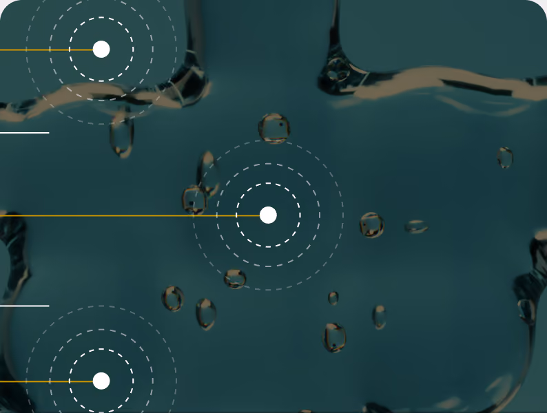 Water droplets on a dark surface with concentric measurement markers