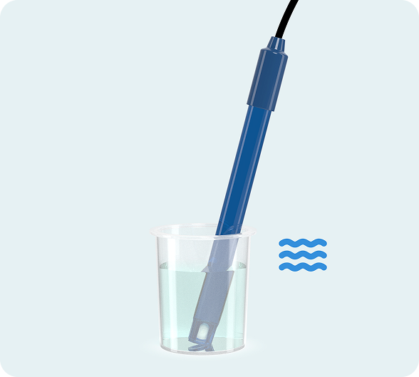 pH pen in a cup of distilled water