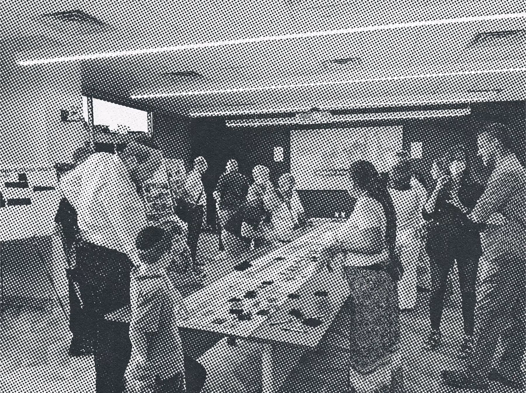 Groups of individuals reviewing prepared materials at a Connect the Dots open house