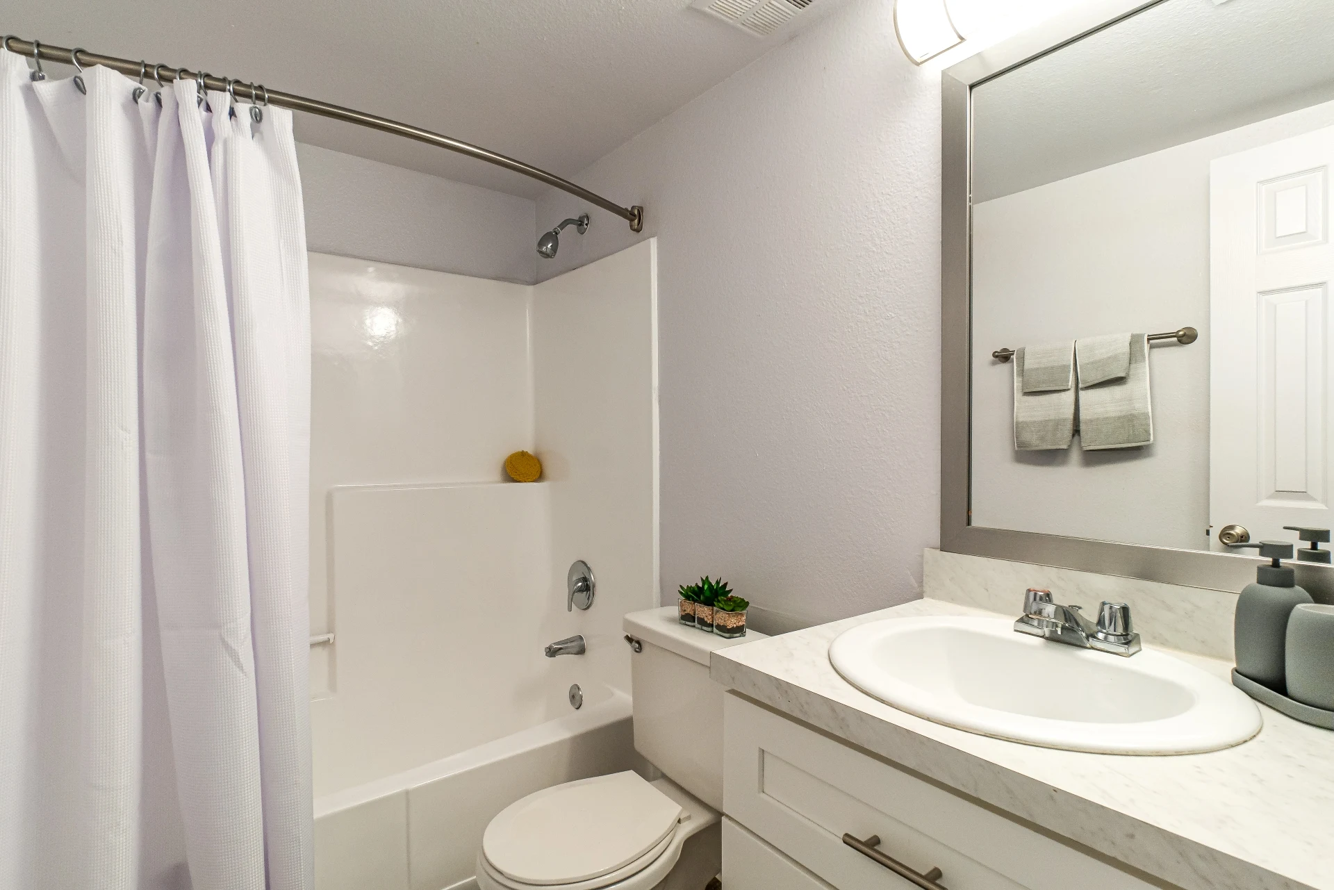 Bathroom with white cabinets