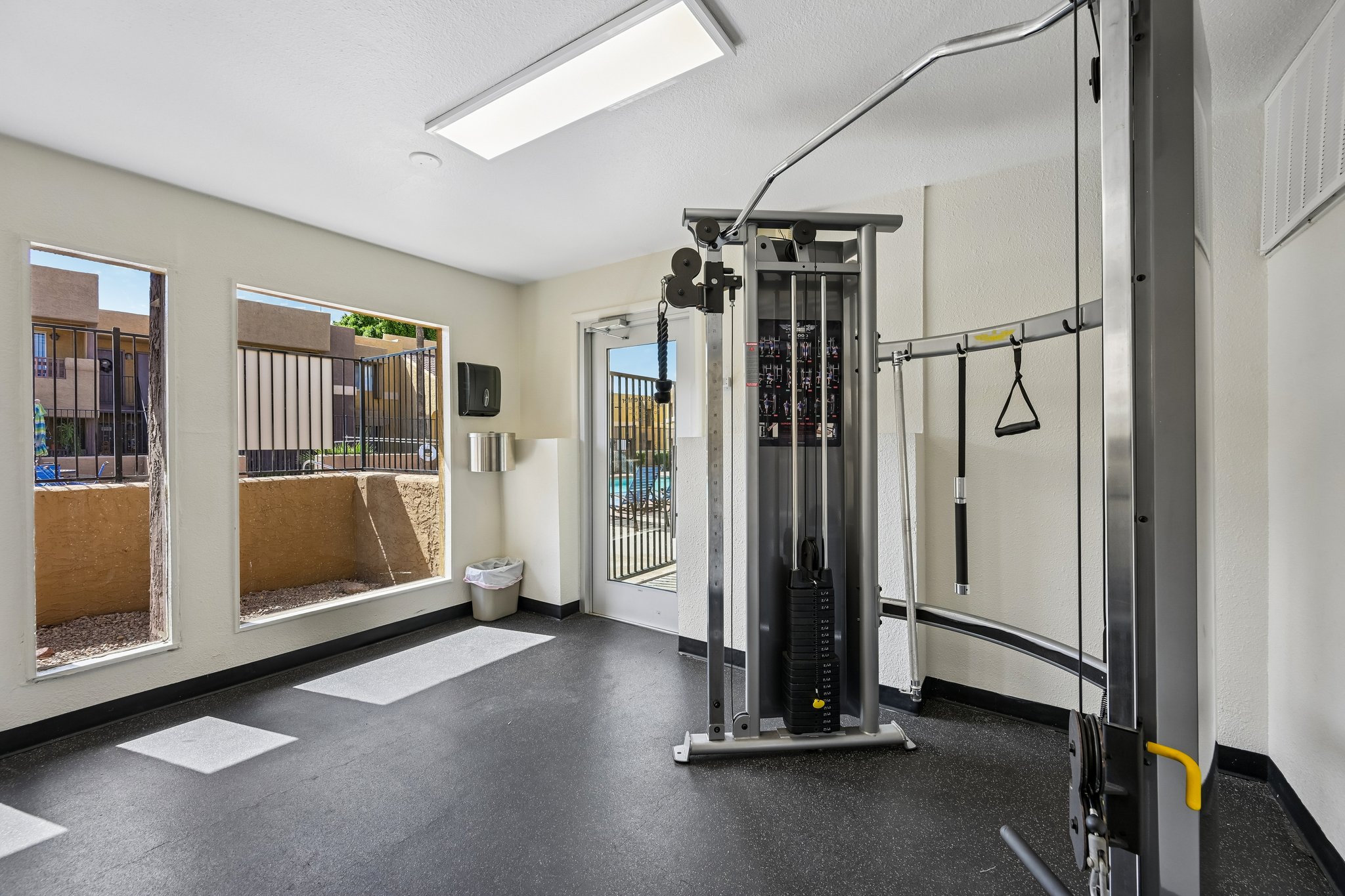 Fitness center with weights and equipment at Papago Crossing apartments in Phoenix, Arizona