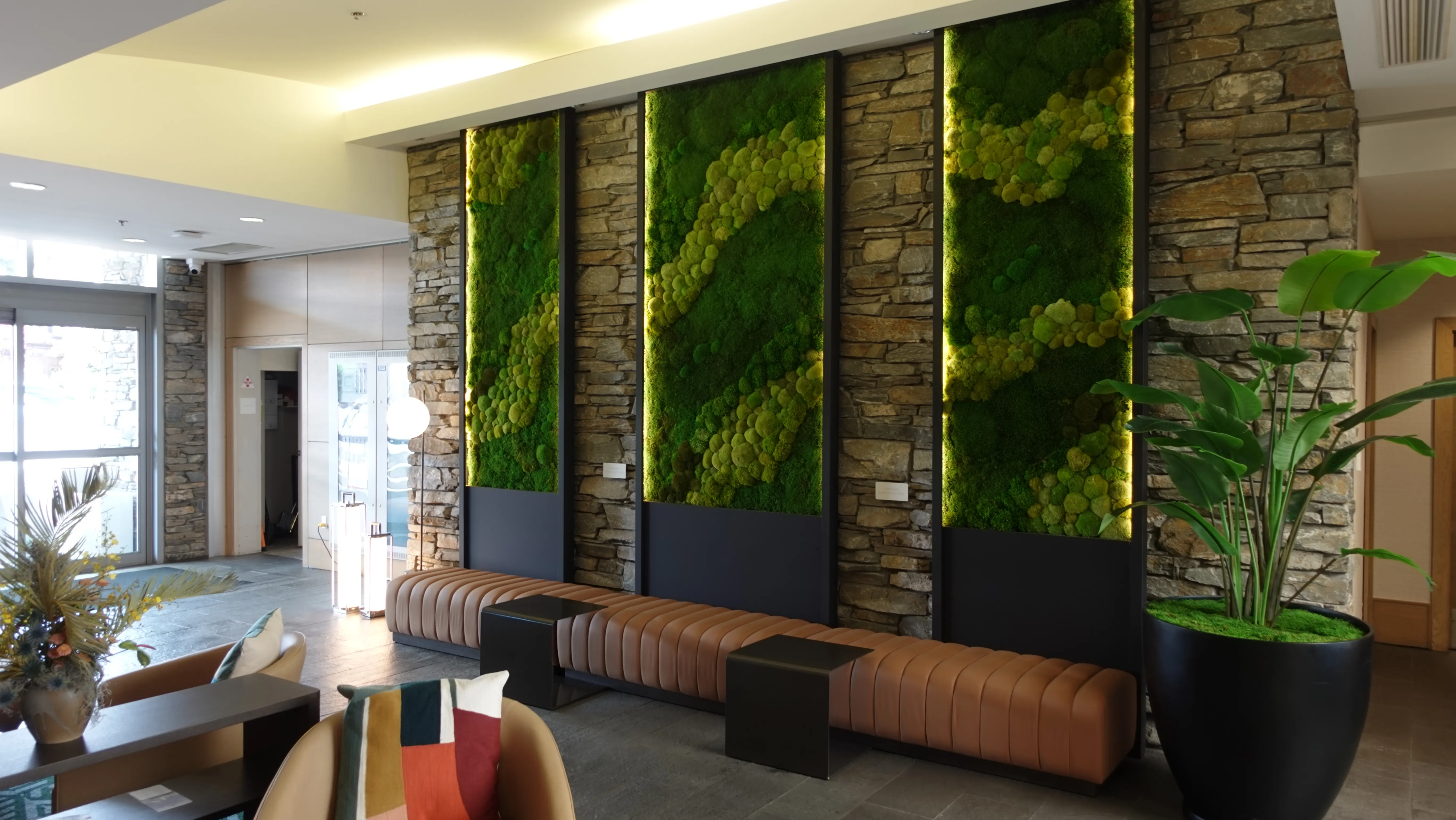 Sidney Pier Hotel & Spa lobby with preserved moss wall panels and sculptural plantings