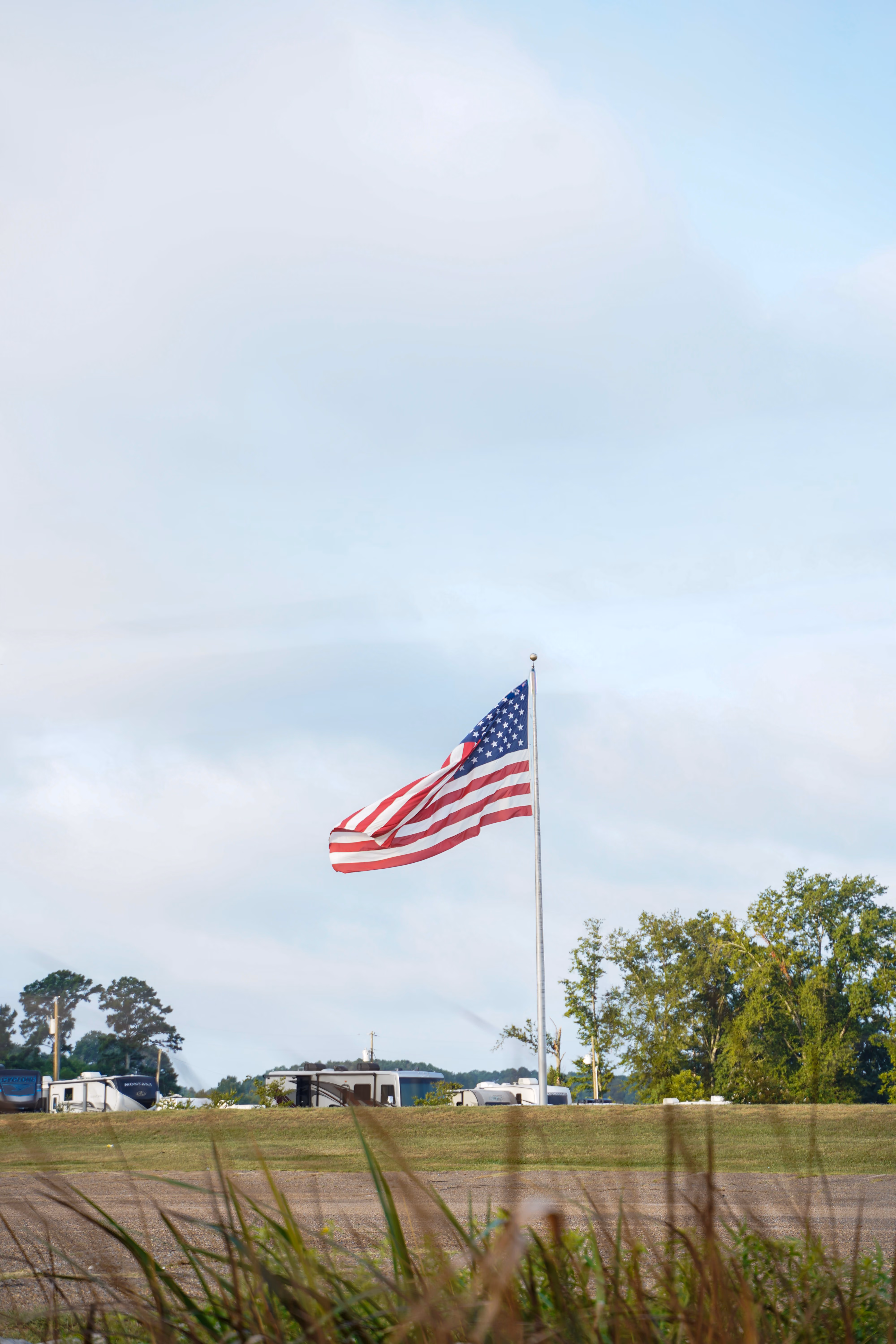 American flag on pole in a central Mississippi field.