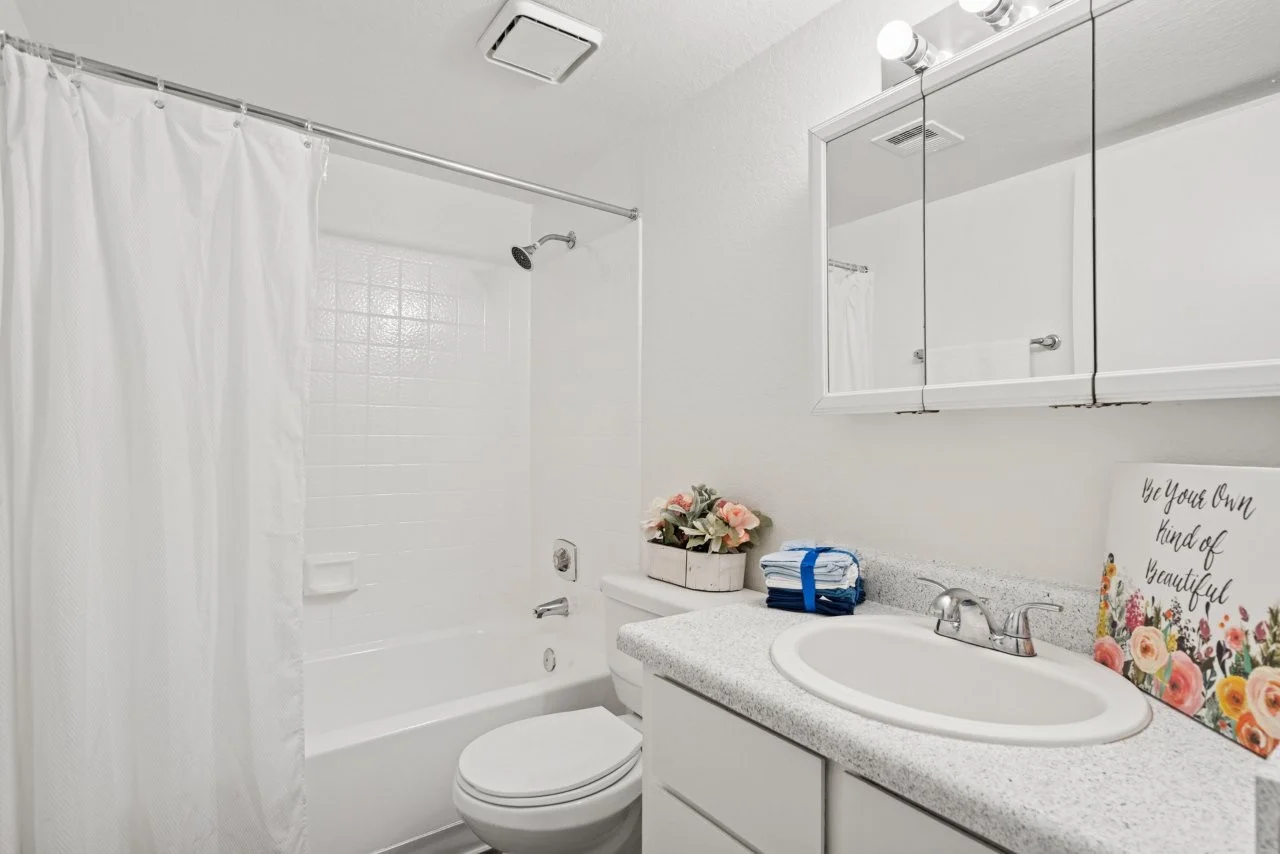 Bathroom with white cabinets