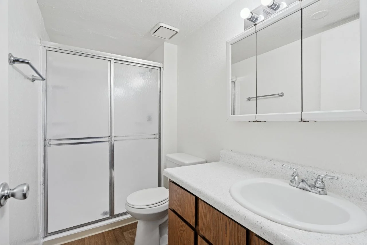 Bathroom with brown cabinets 