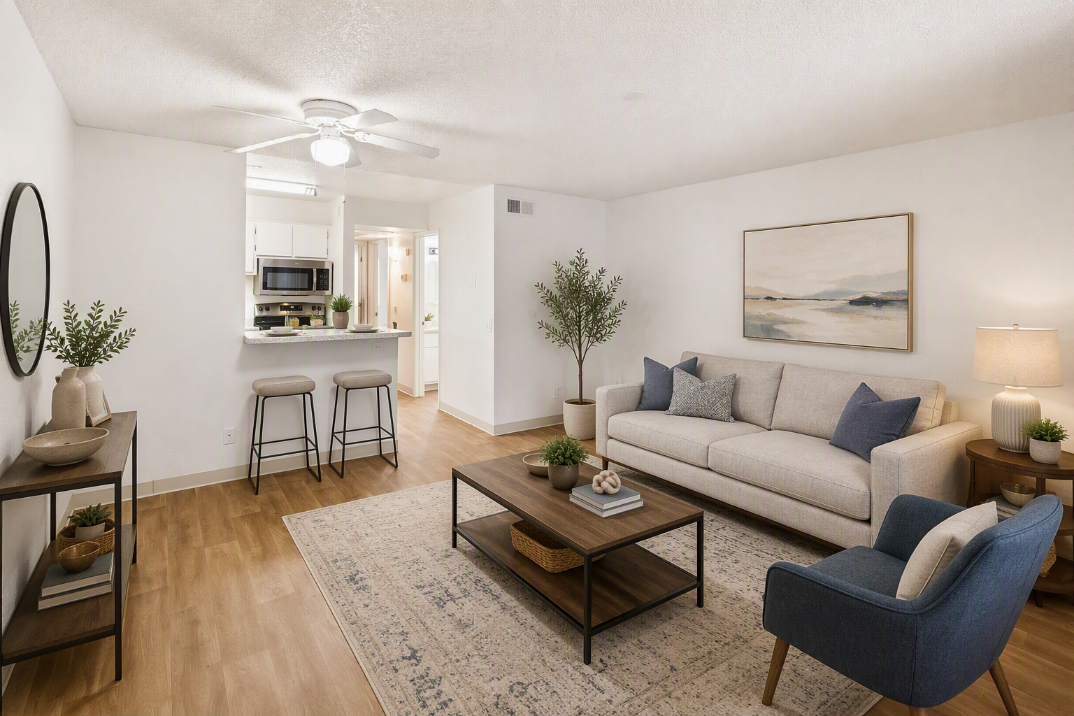 living room with couch and chairs 