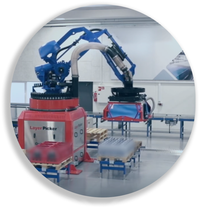 Blue robotic arm labeled Layer Picker lifting items in a clean industrial warehouse.