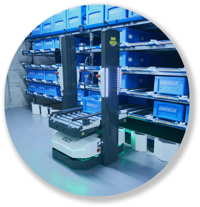 Autonomous mobile robot in warehouse with blue storage bins on metal shelves.