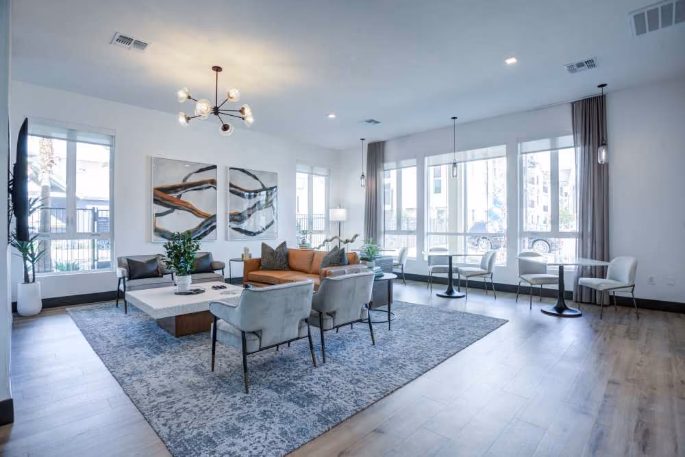 Lounge with sofa, tables, and chairs