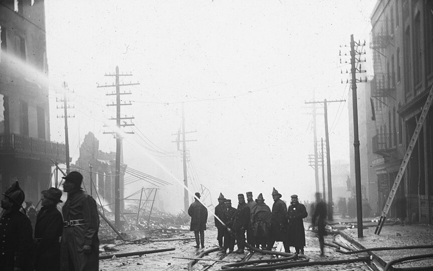 Firefighters and hose lines on Baltimore Street during the Great Baltimore Fire, February 1904. Library of Congress.