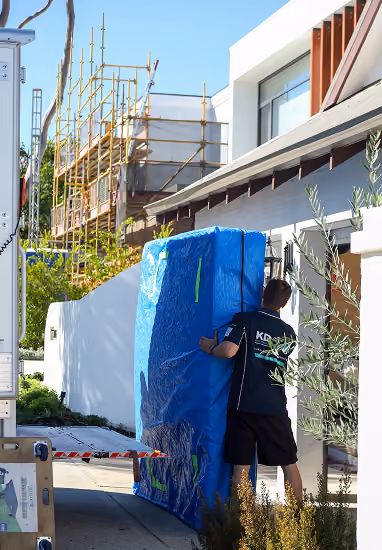 KD removalist securing furniture inside the truck