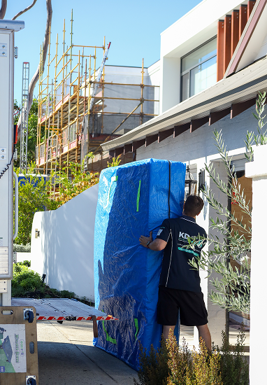KD removalist securing furniture inside the truck