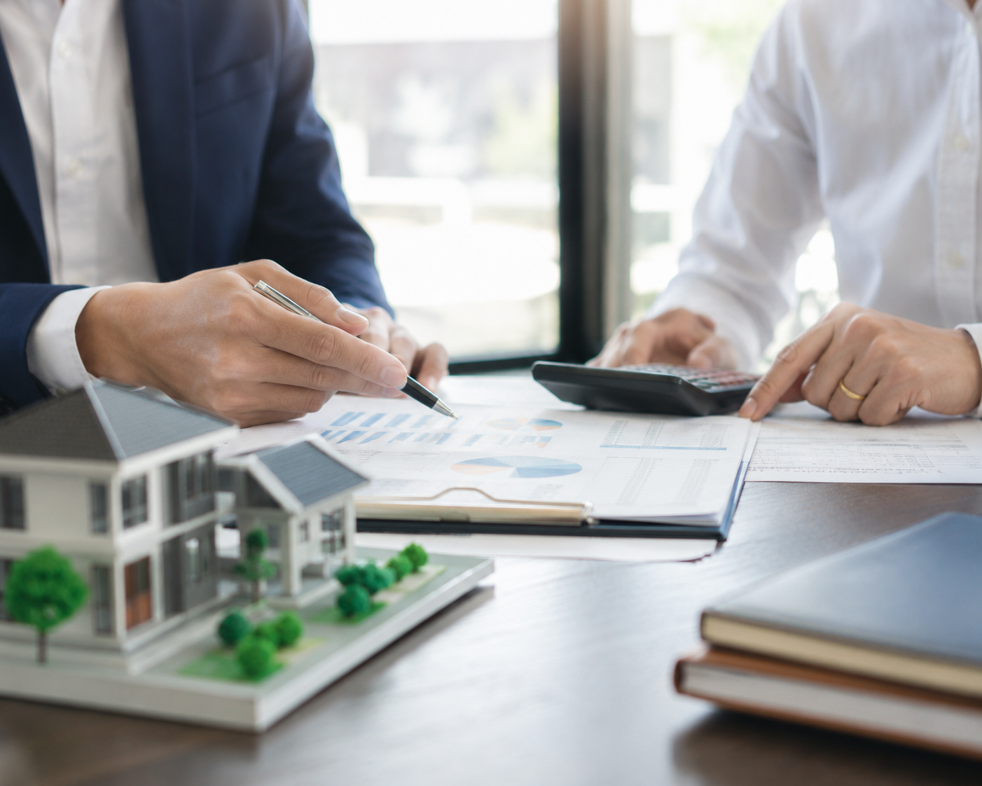 Real estate tax planning documents and calculator representing after-tax return analysis.