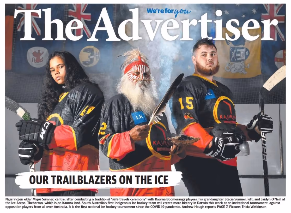 The Advertiser front page featuring two Kaurna Boomerangs ice hockey players with an Indigenous elder during a traditional ceremony, highlighting the team as trailblazers on the ice.
