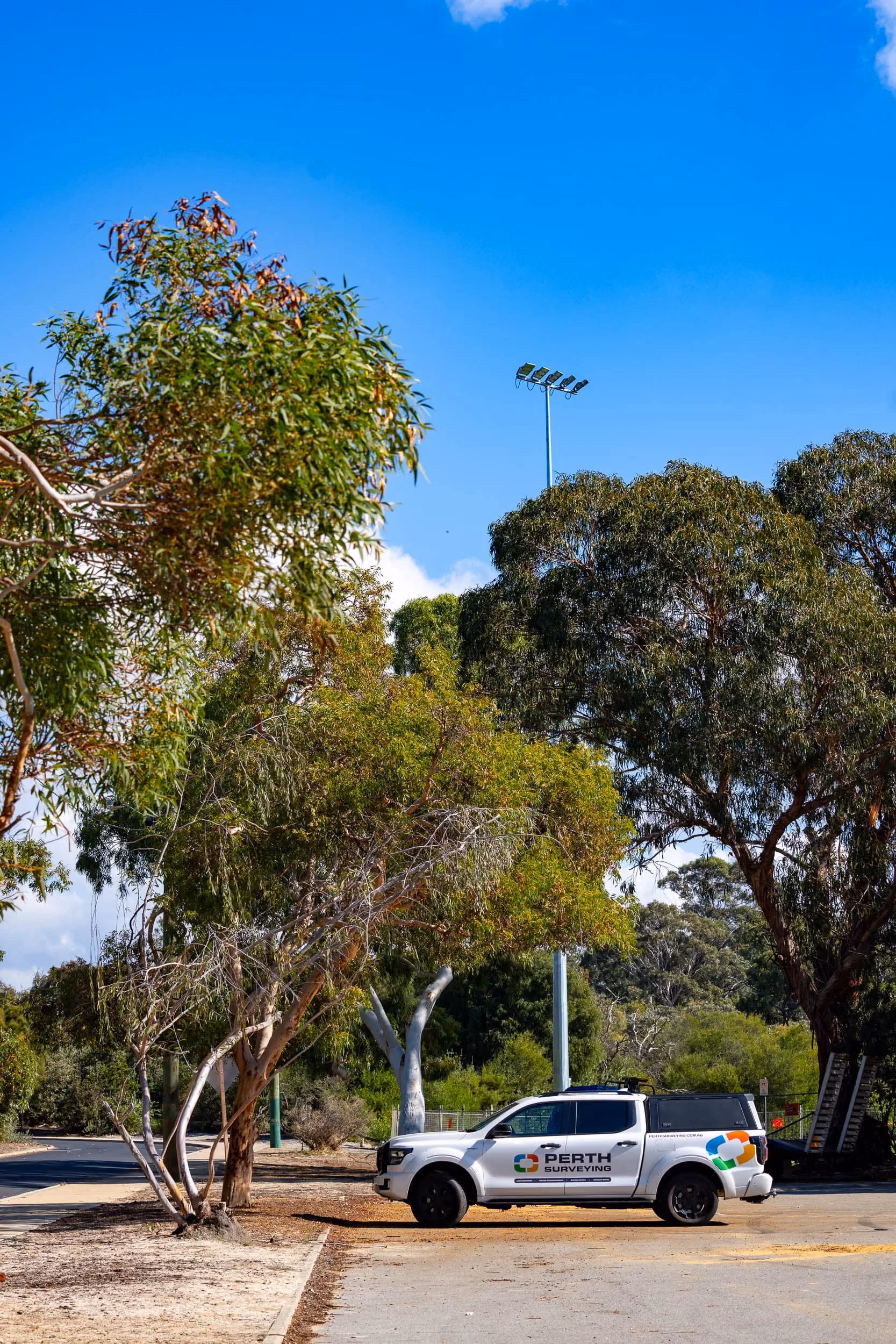 Perth Surveying branded vehicle parked at a local site, showing the company’s visible field presence, professional presentation and readiness to support projects across Western Australia.