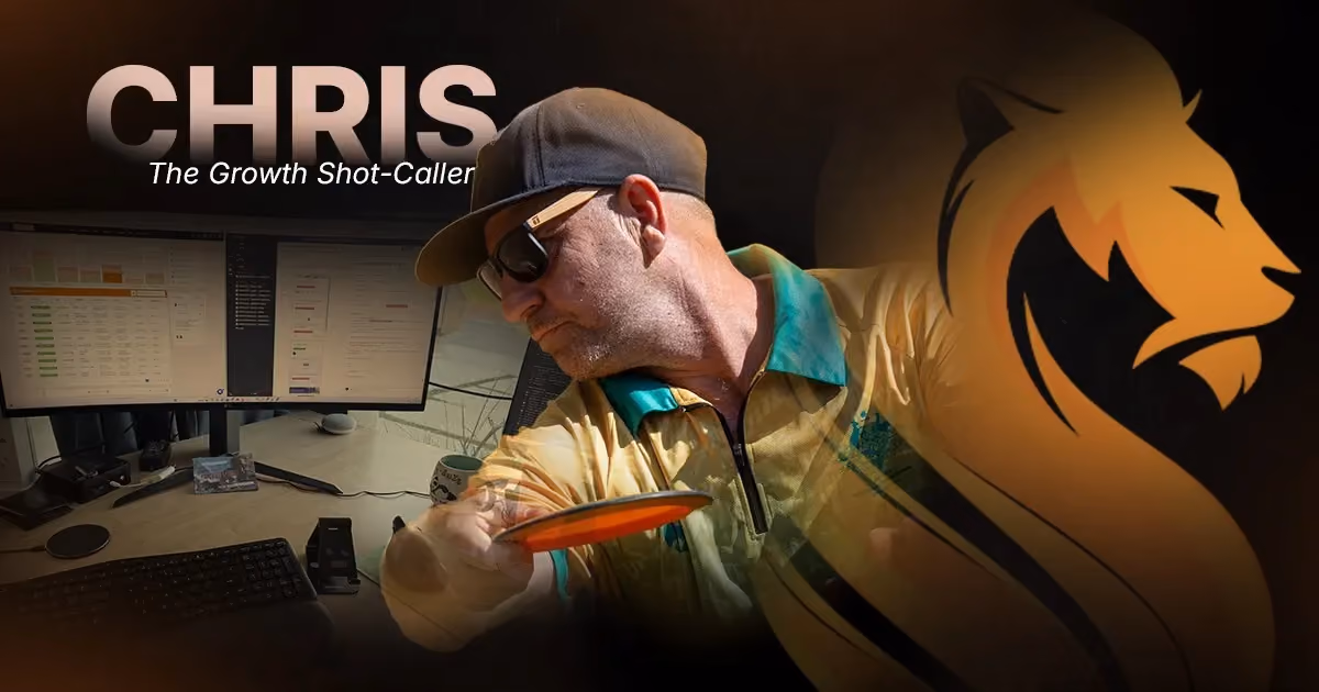 Chris, Wandering Lion’s Growth Shot-Caller, reviewing business systems beside his disc golf gear and workspace.