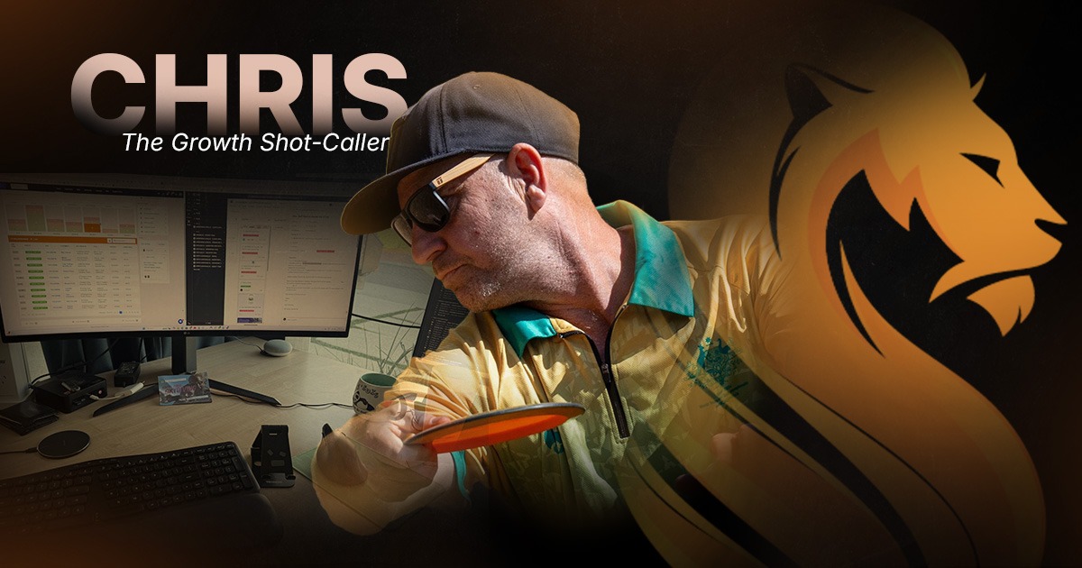 Chris, Wandering Lion’s Growth Shot-Caller, reviewing business systems beside his disc golf gear and workspace.