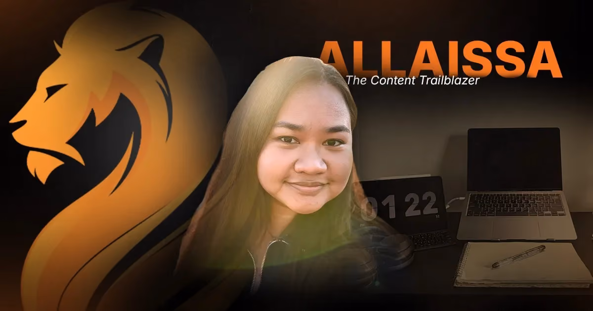 Allaisa, Wandering Lion’s Content Trailblazer, pictured with her remote workspace and branded lion graphic.
