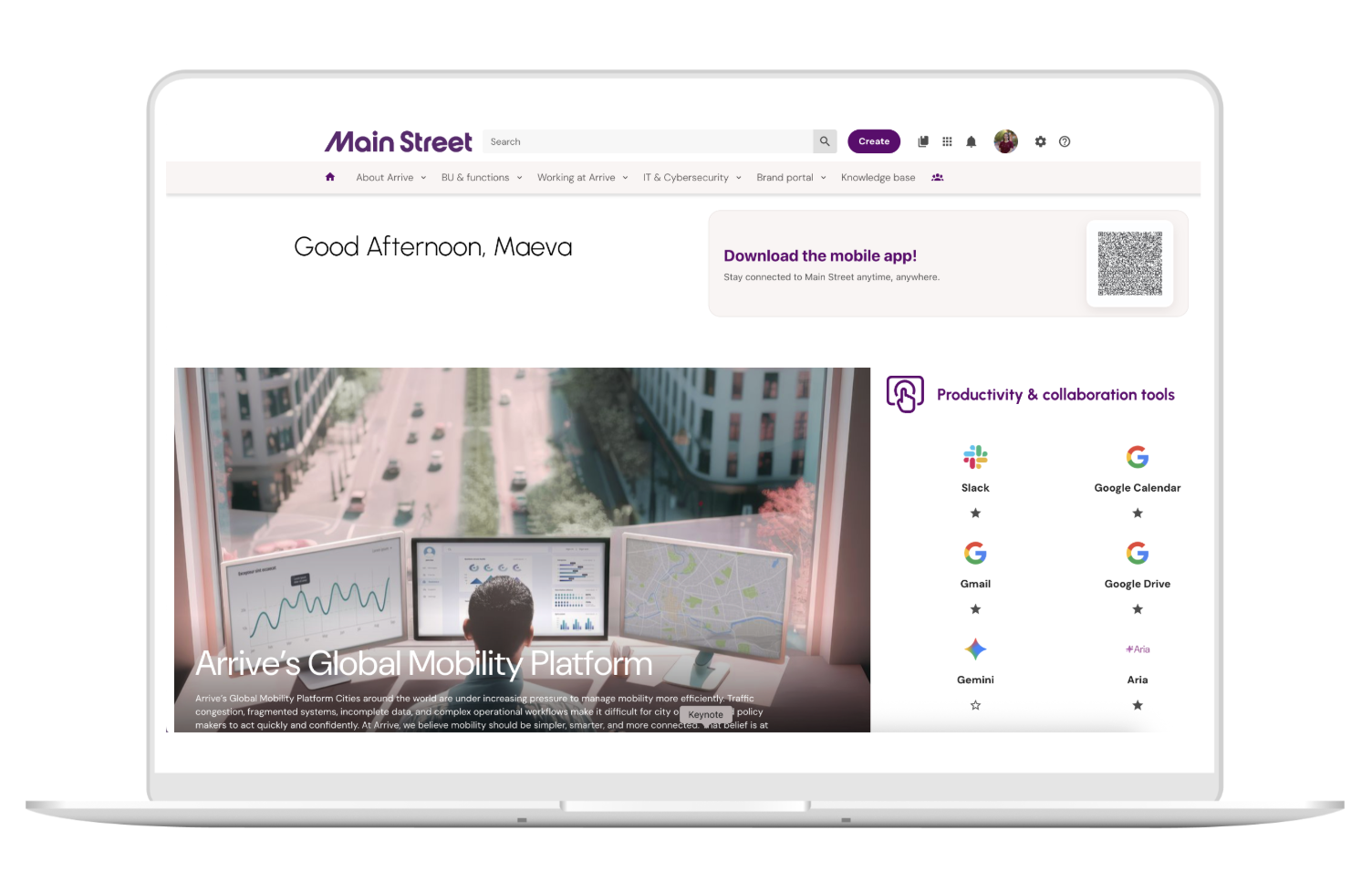 Laptop screen shows Main Street portal with greeting 'Good Afternoon, Maeva,' a banner to download the mobile app, and a section listing productivity tools like Slack, Google Calendar, Gmail, Google Drive, Gemini, and Aria icons, alongside a central image of a person viewed from behind looking at three monitors with graphs, charts, and a map, set against a blurred city street background.