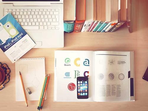 Notebook and planning materials for a coaching business