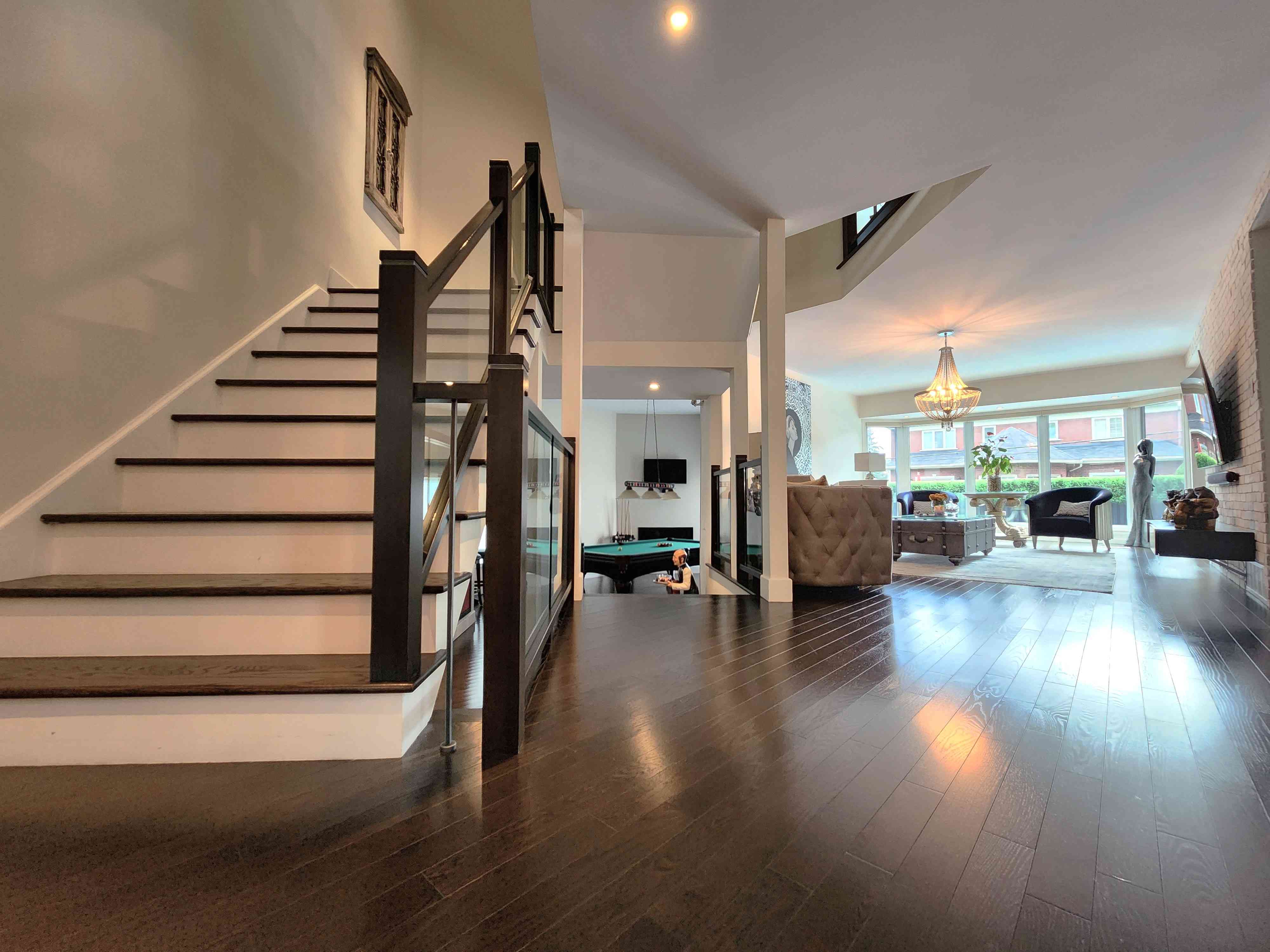 fully renovated living area, game room, stairs and windows