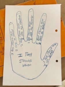 An example of an exercise Eve did with the children. The children drew around their hands and wrote encouraging affirmations to themselves.