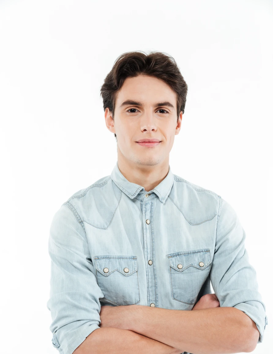 Professional studio portrait of a man with short hair wearing a white shirt and glasses against a clean grey background