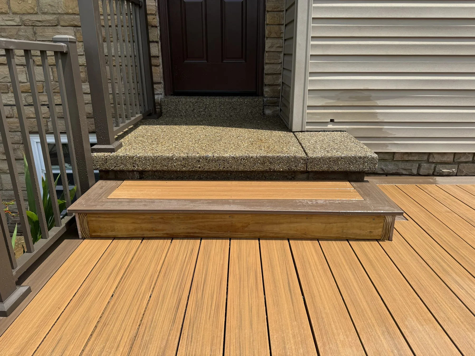 After: finished post skirt and trim detail at the door threshold