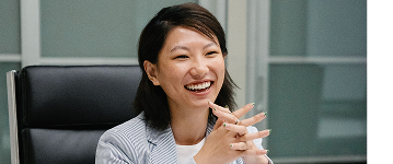 Woman smiling in a meeting