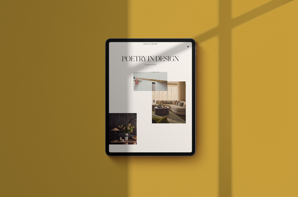 Amalia Boier Studio's homepage on a tablet against a mustard wall, "Poetry in Design" hero section